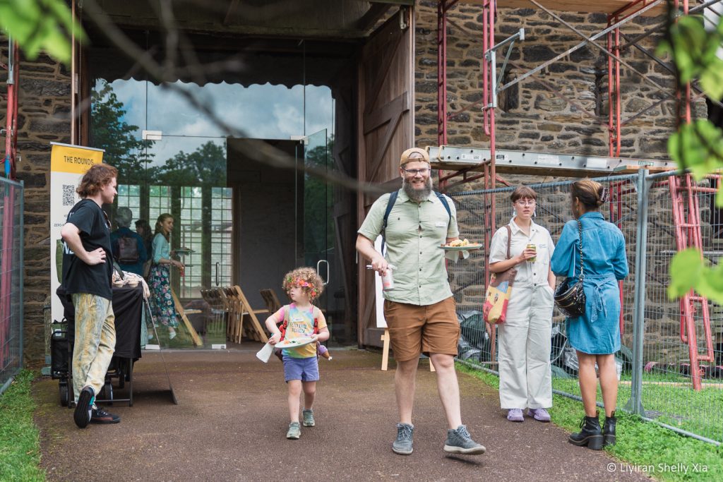 People in front of the Bartram's Garden barn